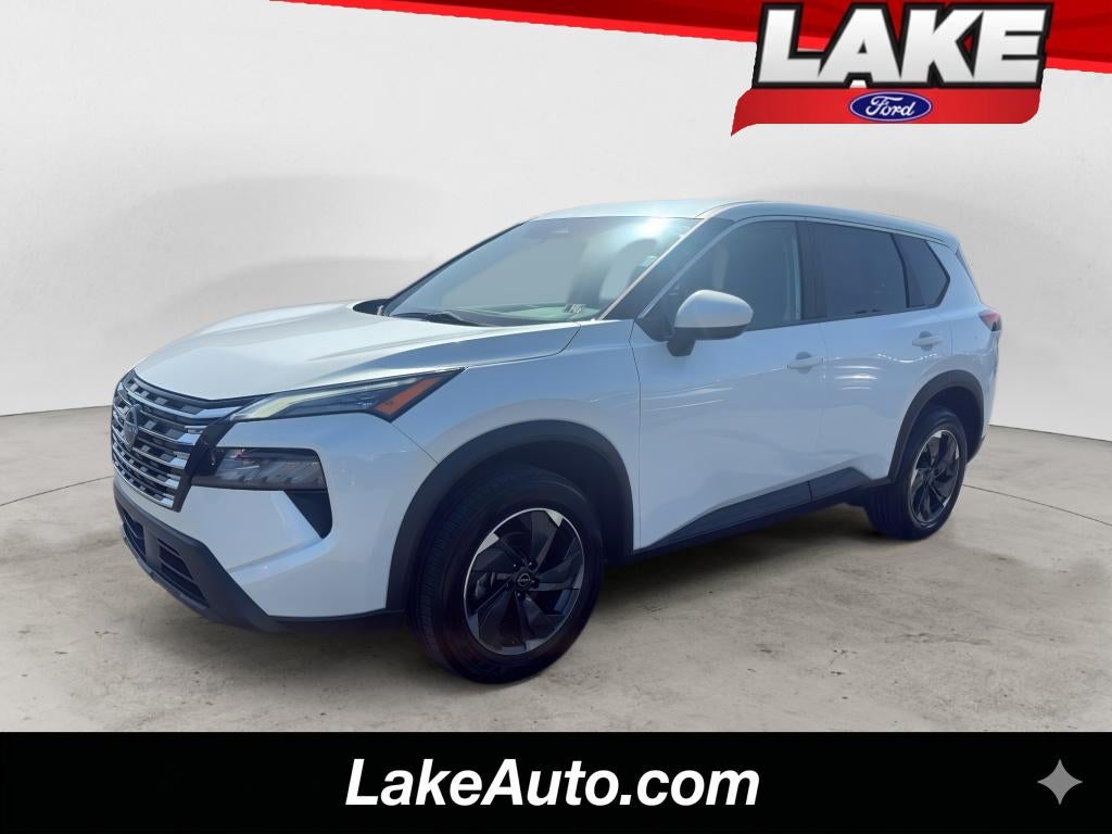 2024 Nissan Rogue SV in Everest White Pearl — front three-quarter view